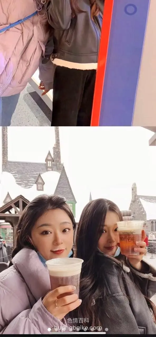 镜头对着两杯饮料，身后是雪景建筑